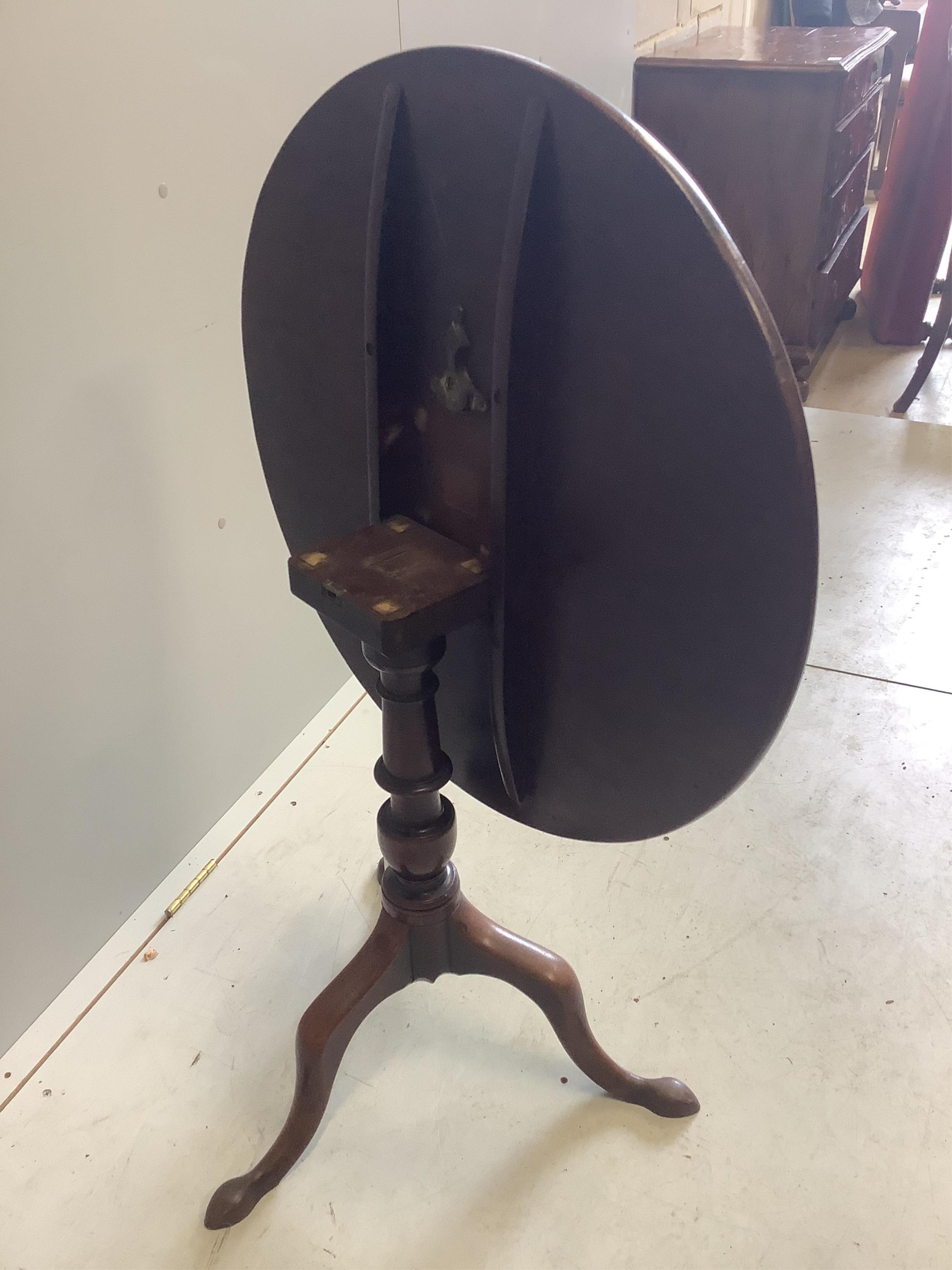 A George III circular mahogany tilt top tea table, diameter 73cm, height 70cm. Condition - fair